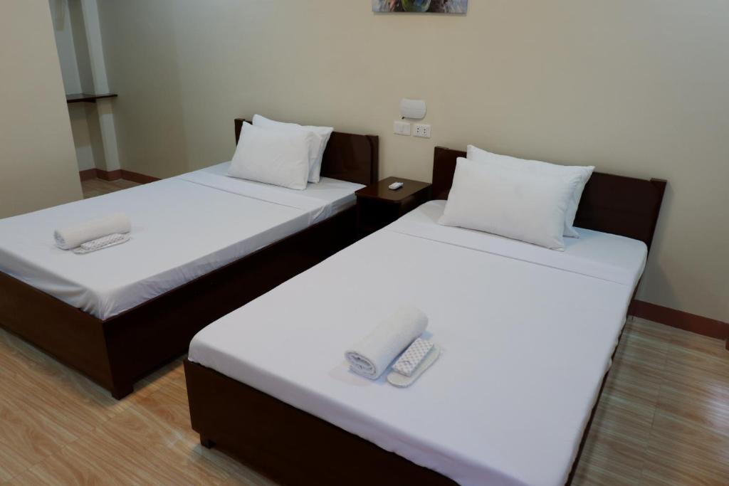 Postel nebo postele na pokoji v ubytování JUN's INN