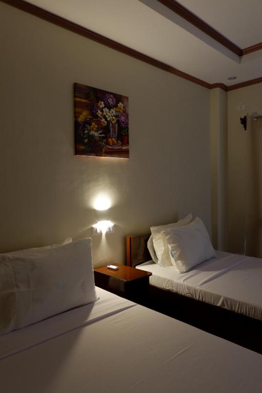 Postel nebo postele na pokoji v ubytování JUN's INN