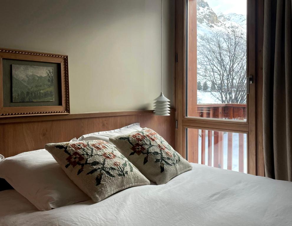 Posteľ alebo postele v izbe v ubytovaní Les Barmettes Appart rénové avec vue, parking et skis aux pieds
