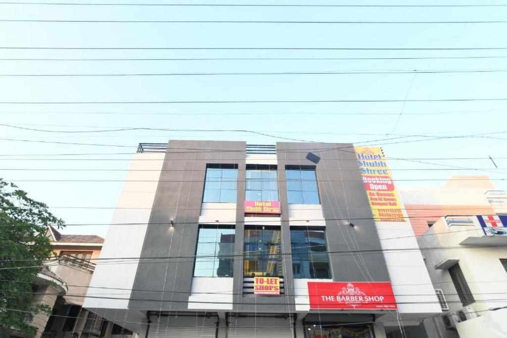 a building with a lot of windows on it at Hotel Shubhshree in Indore