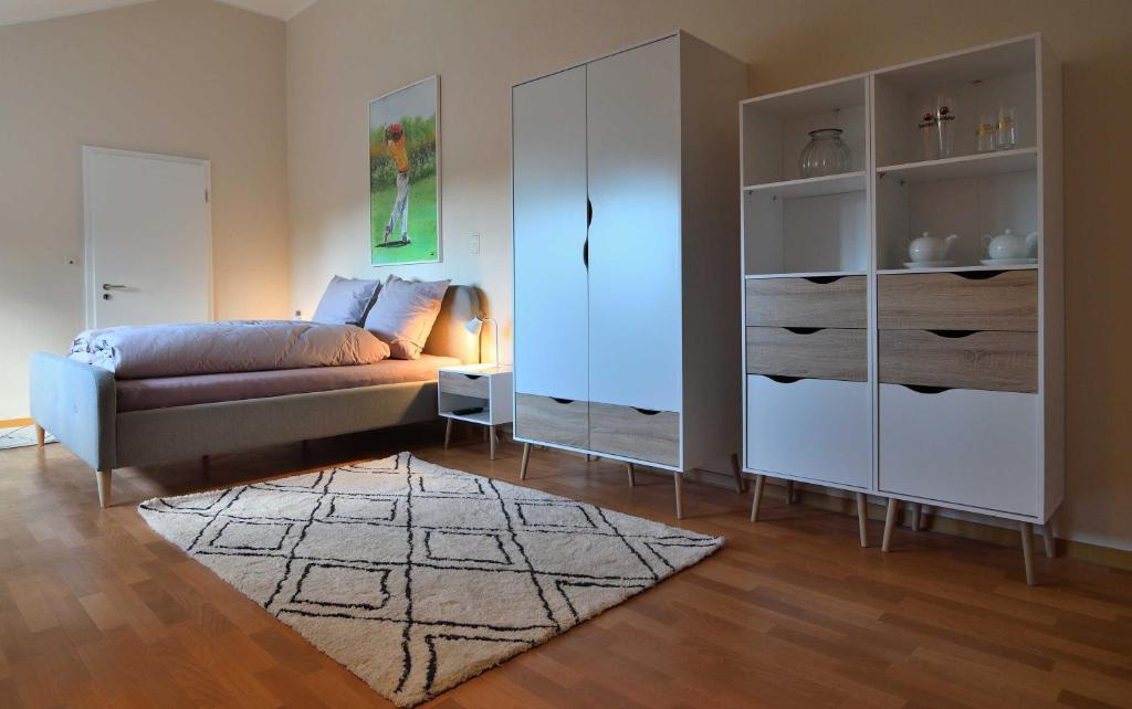 Un pat sau paturi într-o cameră la Appartement Crows Nest
