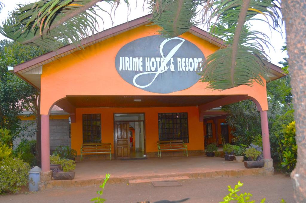 an orange building with a sign on it at jirime hotel &resort in Marsabit