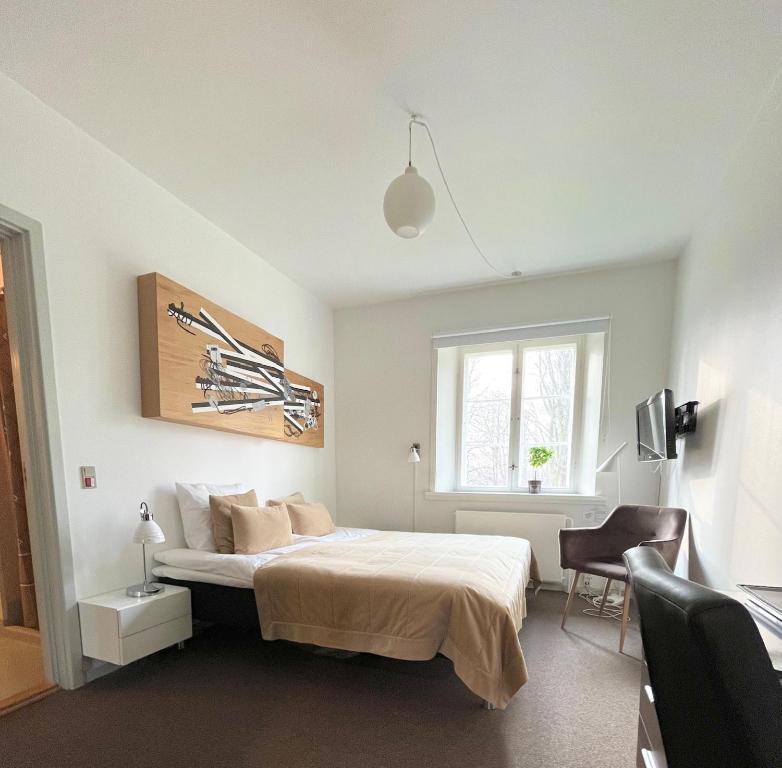 Postel nebo postele na pokoji v ubytování Bernstorff Castle Hotel