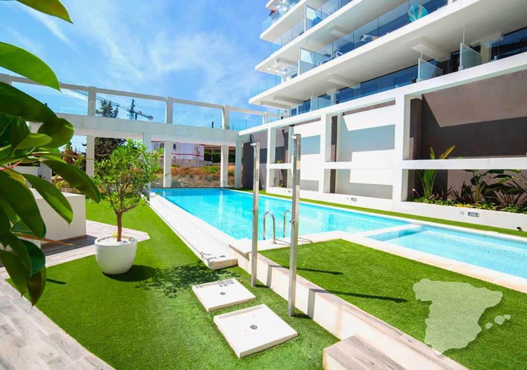 an exterior view of a house with a swimming pool at CostaBlancaDreams Calpe Beach in Calpe in Alicante