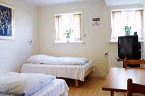 Postel nebo postele na pokoji v ubytování 62N Guesthouse - City Center