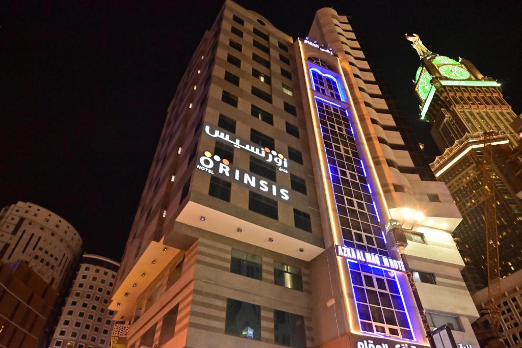 a building with blue lights on the side of it at فندق أورنسيس الحرم in Mecca