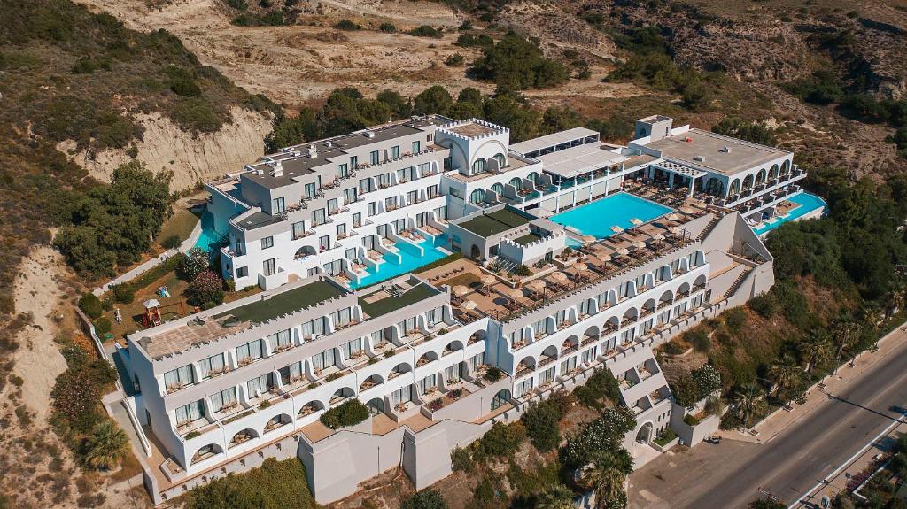 an aerial view of a large building with a swimming pool at Calypso Palace in Faliraki