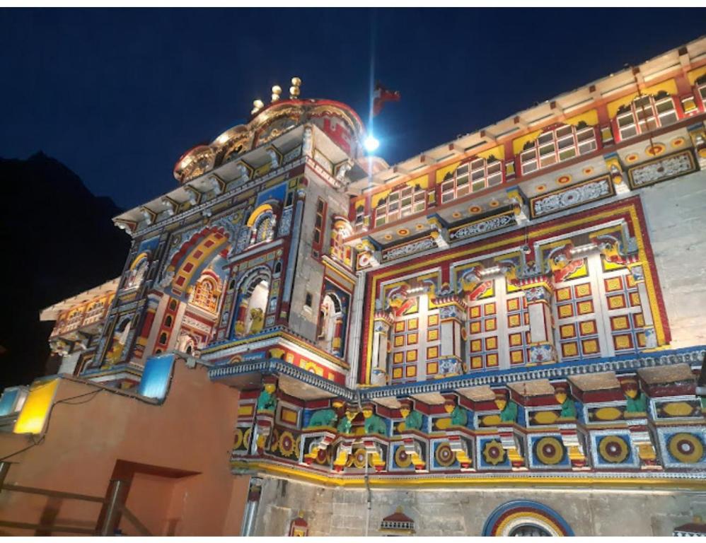 a large building with lights on it at night at HOTEL HIMGIRI, Shri Badrinath in Badrinath
