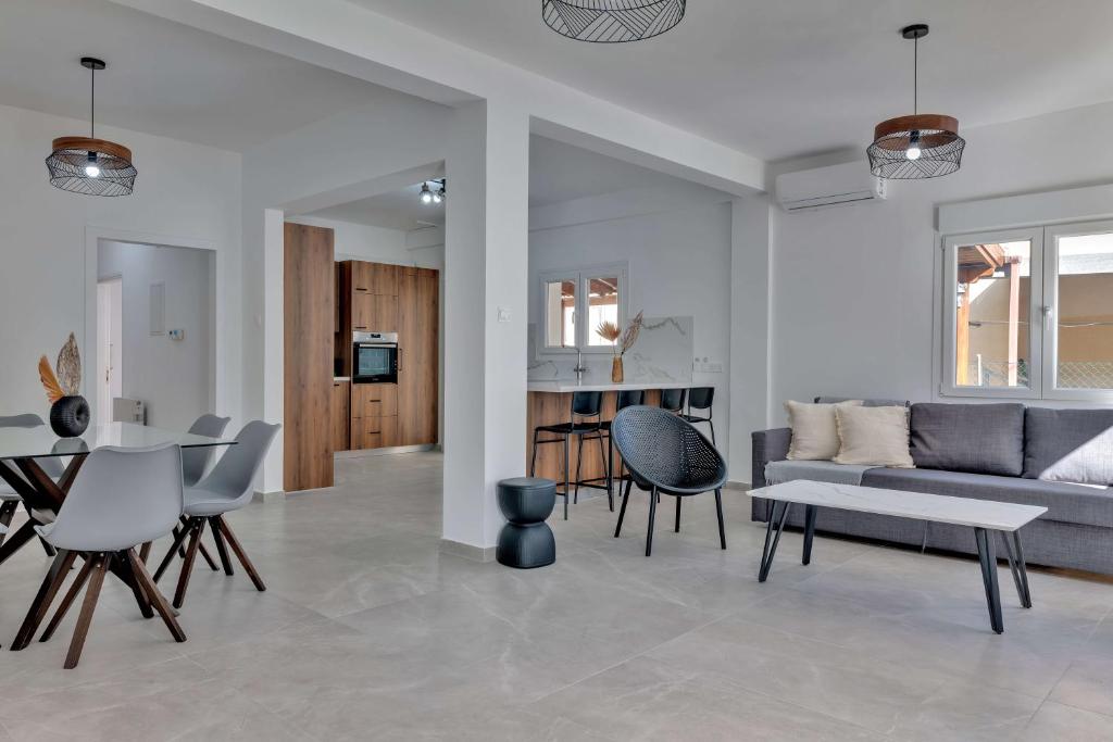 a living room with a couch and chairs and a table at Phaedrus Living: Luxury Residence Faneromeni in Larnaca