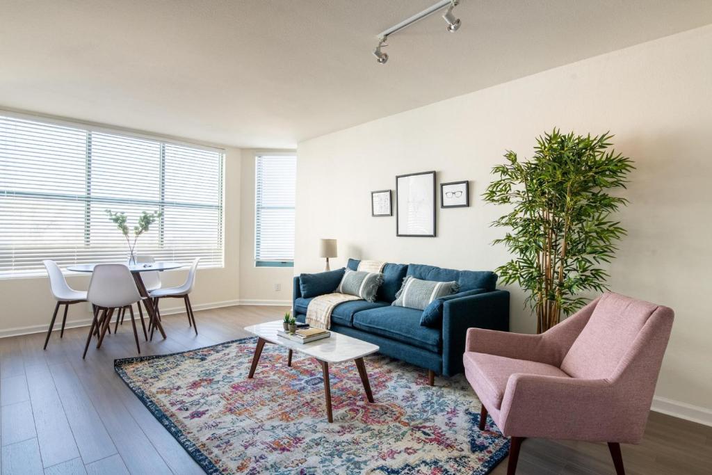 a living room with a couch and chairs and a table at South Beach 2br w tennis nr public transport SFO-1663 in San Francisco