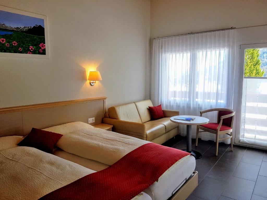 Postel nebo postele na pokoji v ubytování Chalet-Gafri - BnB - Frühstückspension und Gastfreundschaft