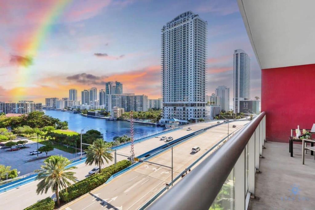 a view of a city skyline with a rainbow at Spectacular Balcony - Near Beach - Gym - Pool in Hallandale Beach