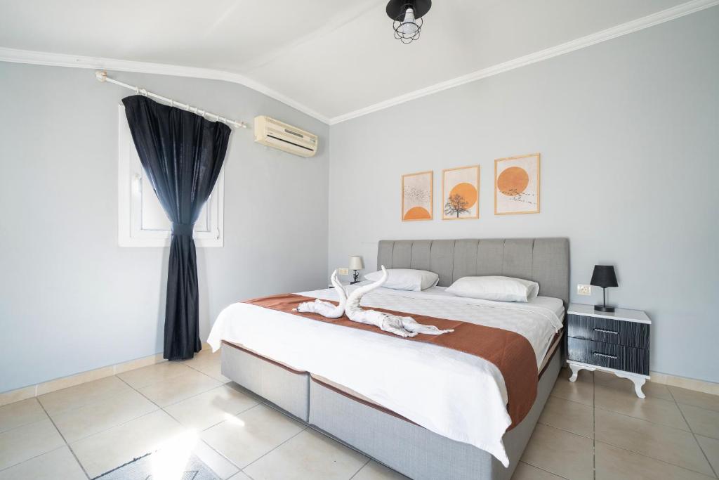Postel nebo postele na pokoji v ubytování MASAL APART HOTEL