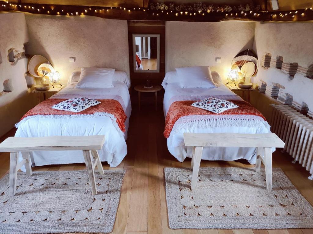 Postel nebo postele na pokoji v ubytování Manoir le Courtillon