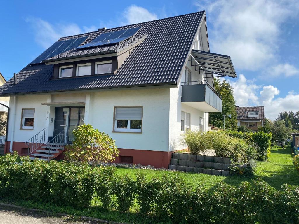 a house with solar panels on the roof at Ferienwohnung Bianca in Ettenheim
