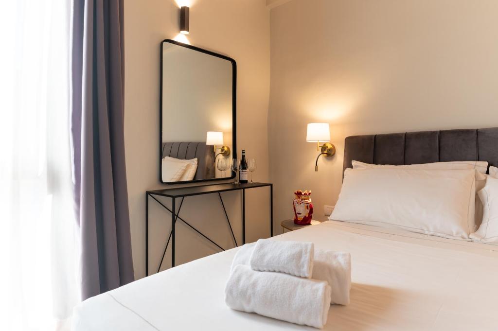 Postel nebo postele na pokoji v ubytování Bastione Spasimo Boutique Hotel