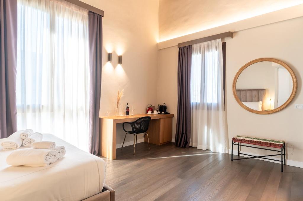 Postel nebo postele na pokoji v ubytování Bastione Spasimo Boutique Hotel