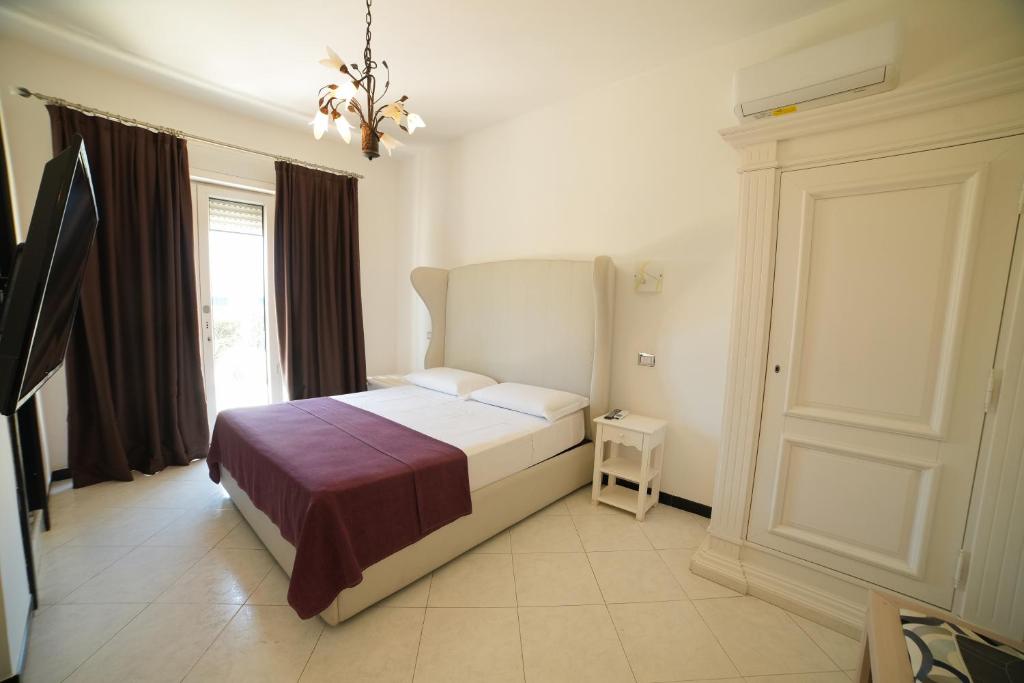Postel nebo postele na pokoji v ubytování Villa Miramare