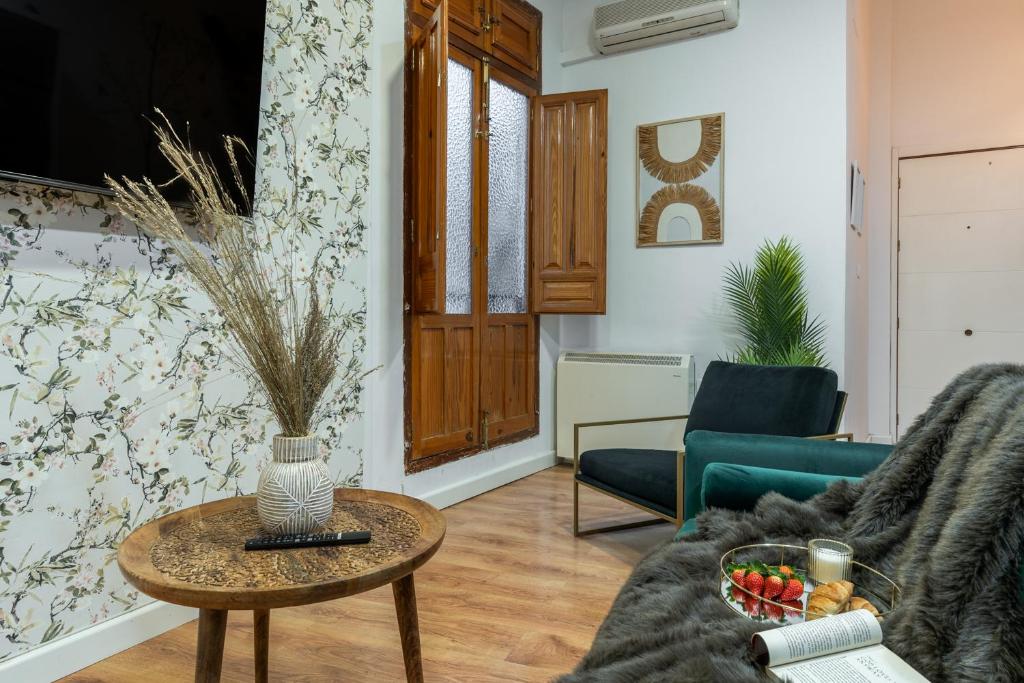 a living room with a couch and a table at tuGuest Cetti Meriem Apartment in Granada