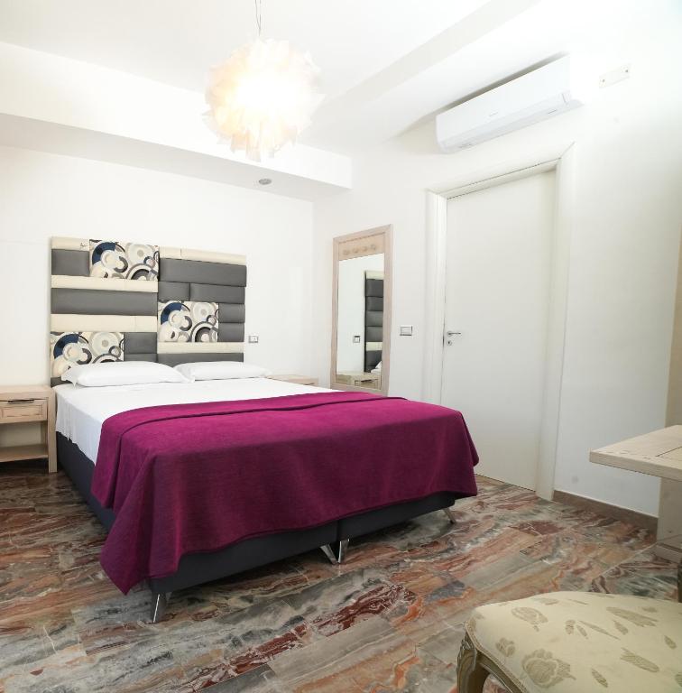 Postel nebo postele na pokoji v ubytování Villa Miramare