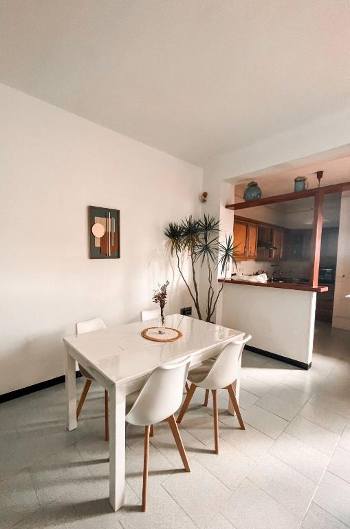a white dining table and chairs in a room at Casa Almonte in Almonte