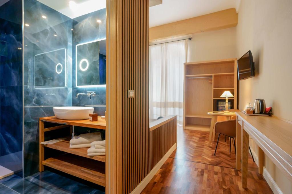 a bathroom with a shower and a sink at Palazzo Pischedda in Bosa