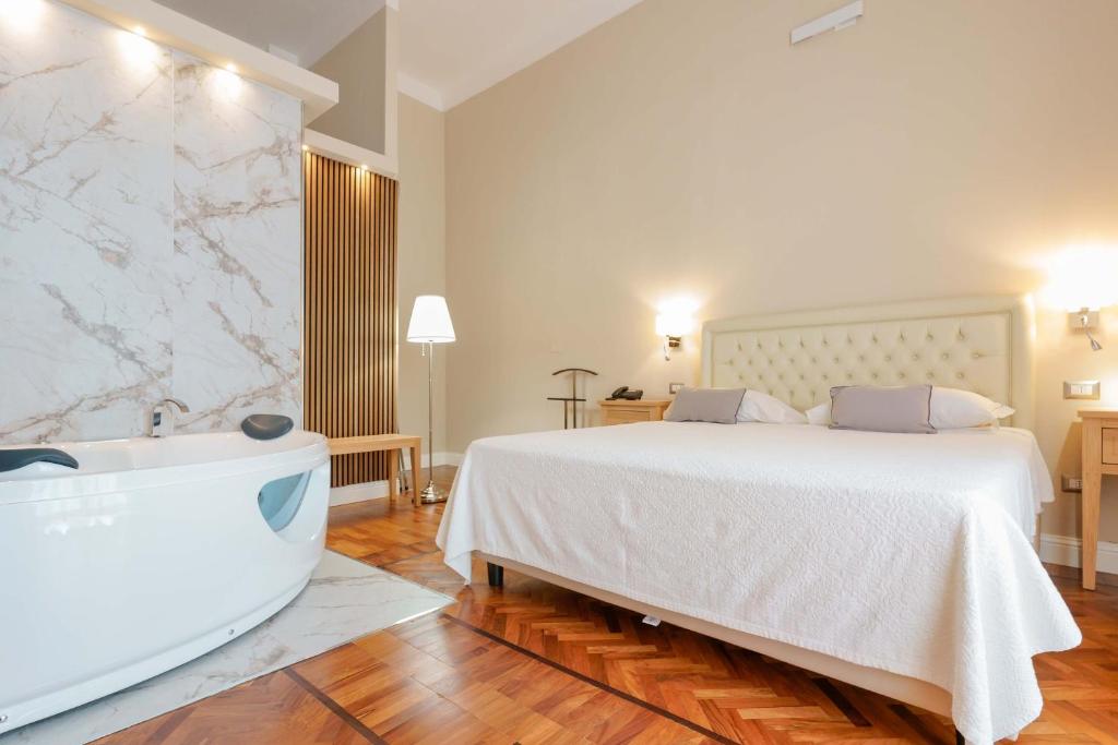 Giường trong phòng chung tại Palazzo Pischedda