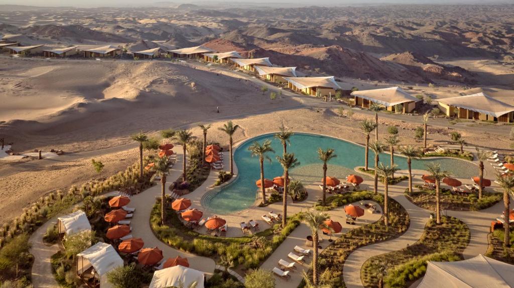 an aerial view of a resort in the desert at Six Senses Southern Dunes, The Red Sea 