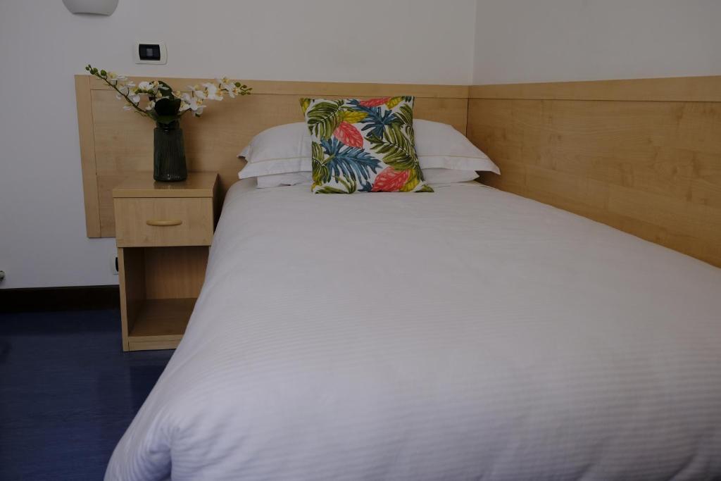 Postel nebo postele na pokoji v ubytování Hotel Milano