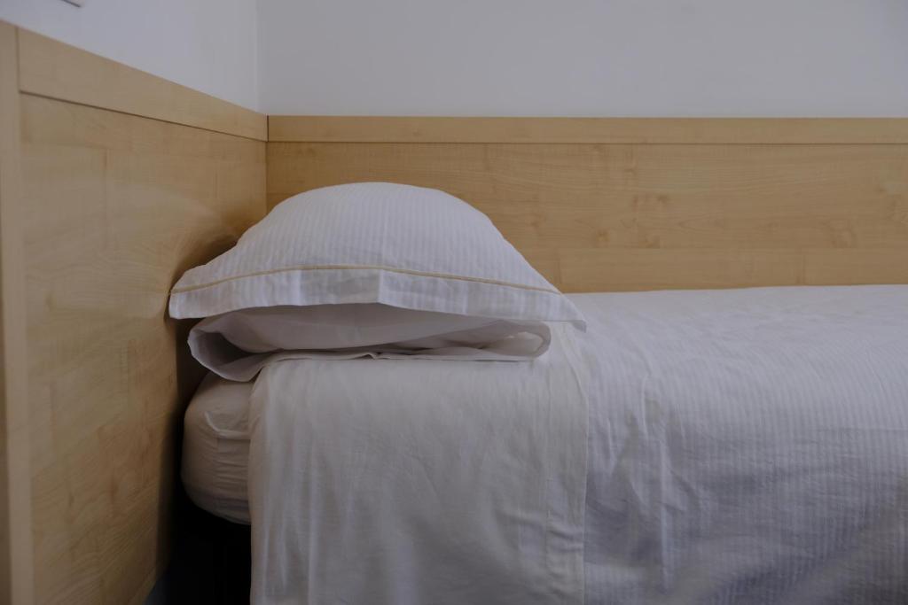 Postel nebo postele na pokoji v ubytování Hotel Milano