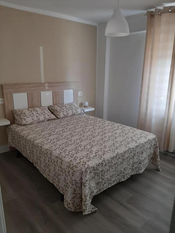 Postel nebo postele na pokoji v ubytování Reconquista 1