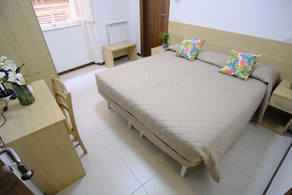 Postel nebo postele na pokoji v ubytování Hotel Milano