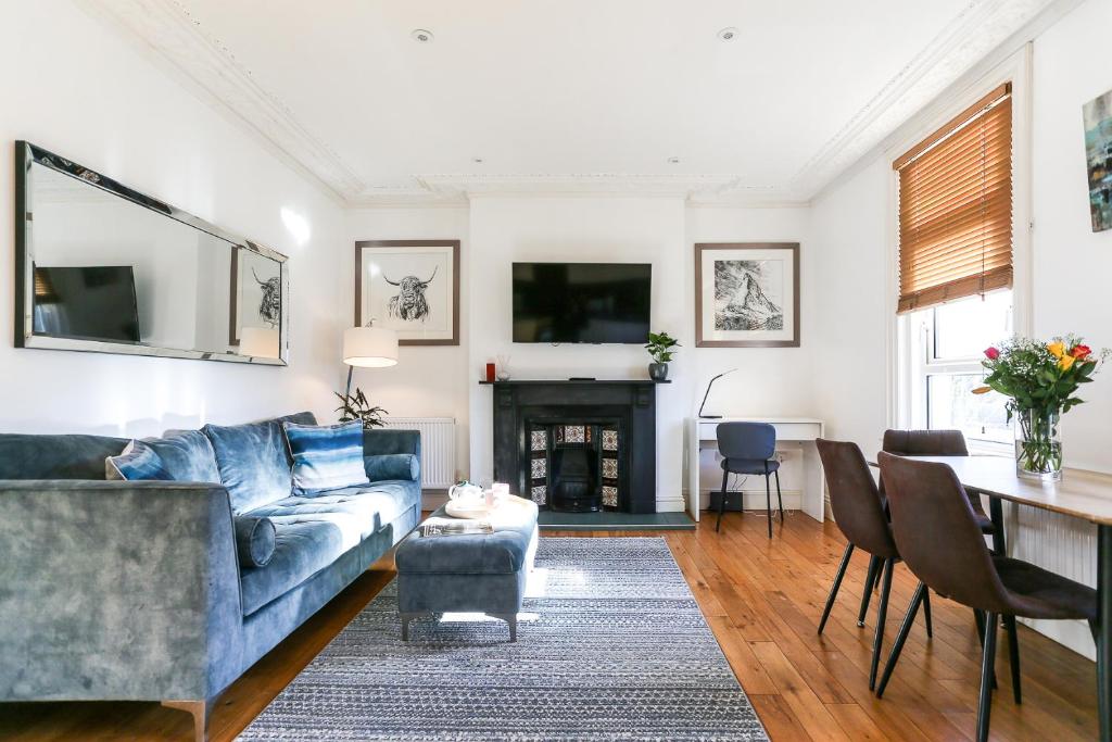 a living room with a couch and a table at Newbridge Road, One bedroom Apartment in Bath