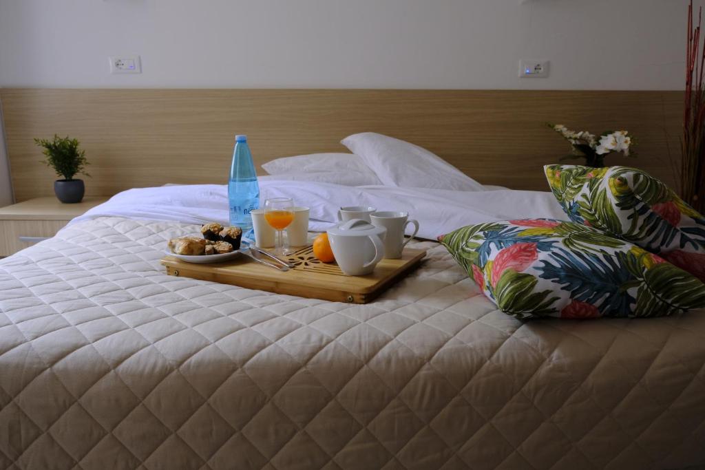 Postel nebo postele na pokoji v ubytování Hotel Milano