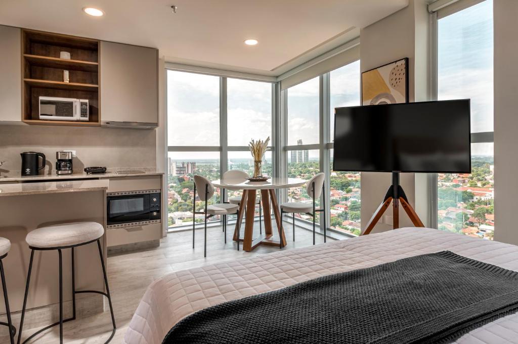A kitchen or kitchenette at ÚNICO - Stay & Residences by AVA