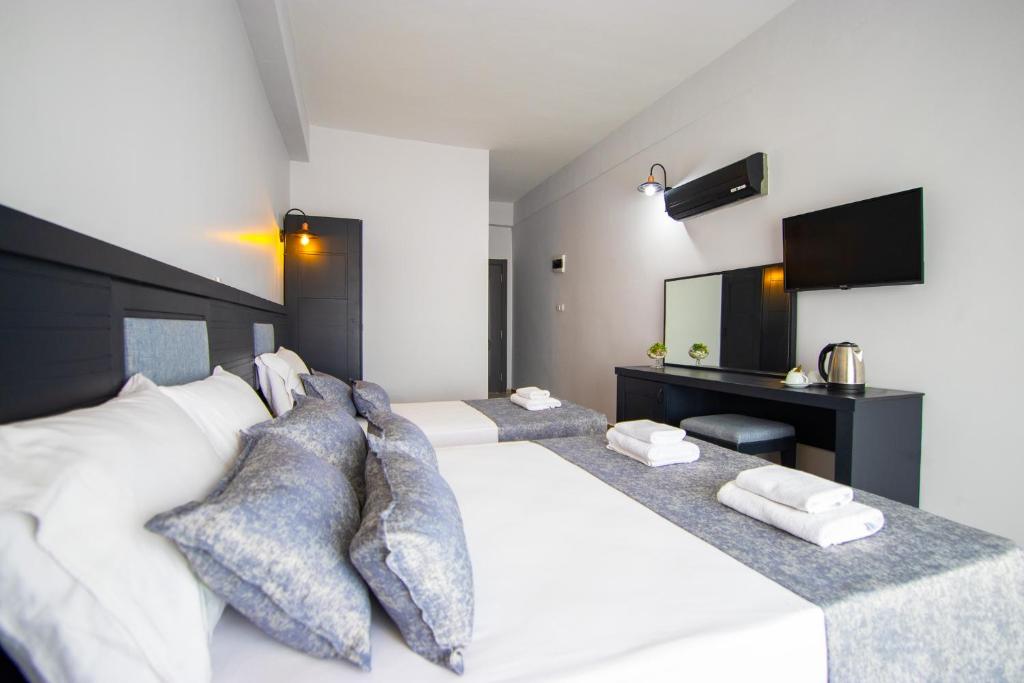 Postel nebo postele na pokoji v ubytování Hotel Le Marin