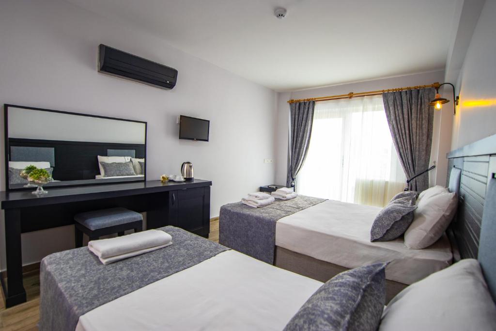Postel nebo postele na pokoji v ubytování Hotel Le Marin