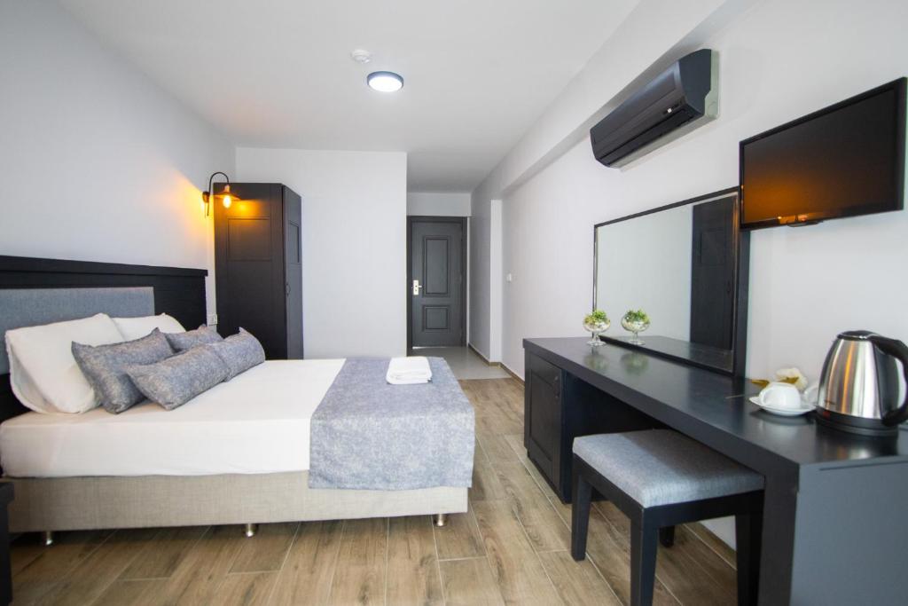 Postel nebo postele na pokoji v ubytování Hotel Le Marin