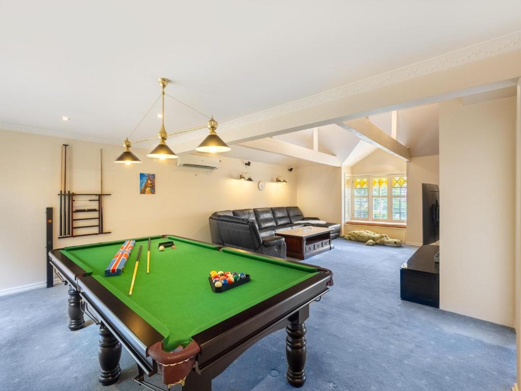 a living room with a pool table in it at 4BR German style Villa w Pool Eight Mile Plains in Brisbane