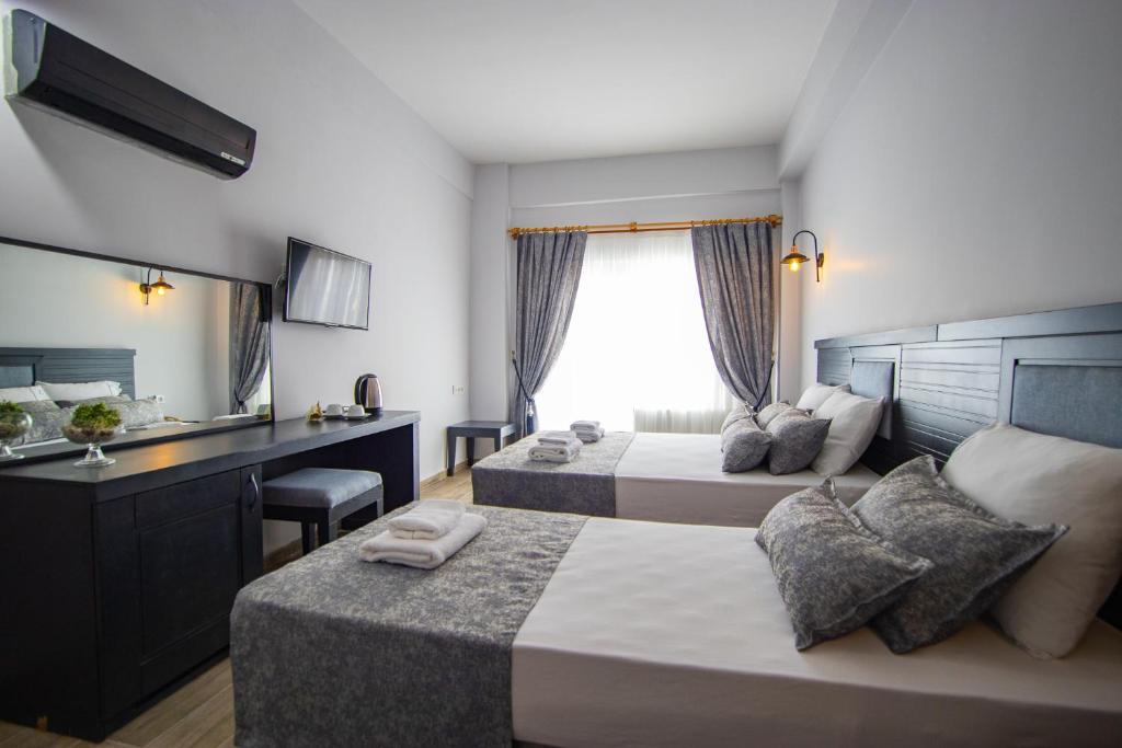 Postel nebo postele na pokoji v ubytování Hotel Le Marin