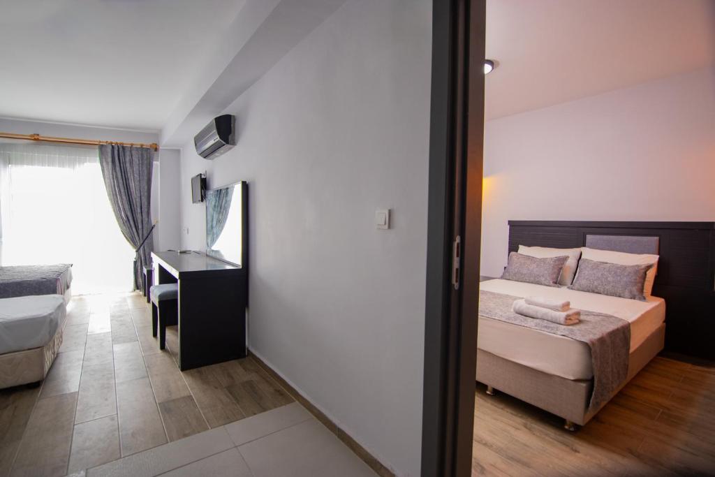 Postel nebo postele na pokoji v ubytování Hotel Le Marin