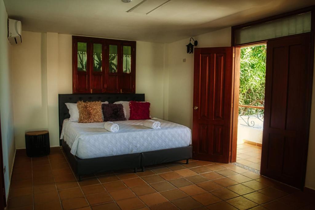 Кровать или кровати в номере Hotel Casa Bethel