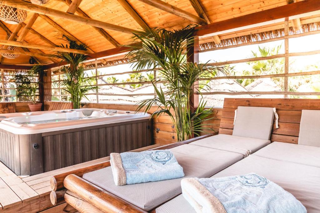 a jacuzzi tub in a wooden house at Toison D'or in Saint-Tropez