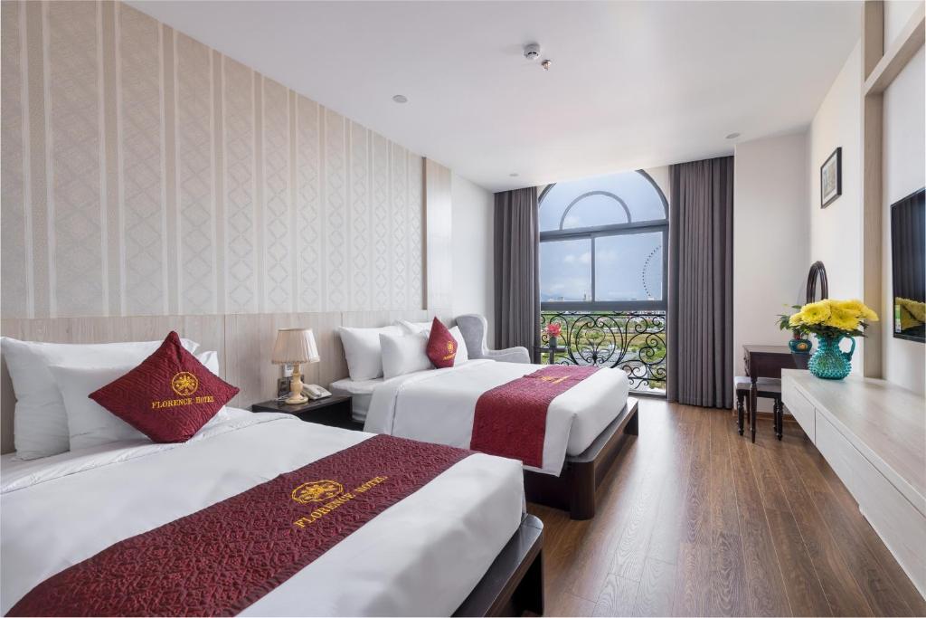 Postel nebo postele na pokoji v ubytování Florence Hotel