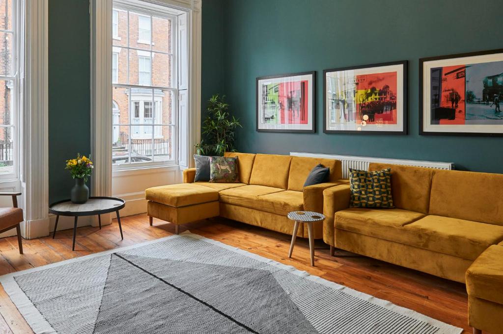 a living room with a couch and a table at Host & Stay - The Georgian Quarters at Falkner Street in Liverpool