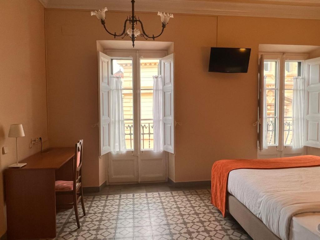 Postel nebo postele na pokoji v ubytování Hotel Noucentista