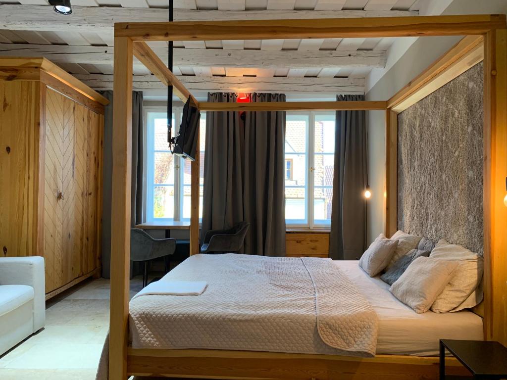 Postel nebo postele na pokoji v ubytování Hotel Desatero