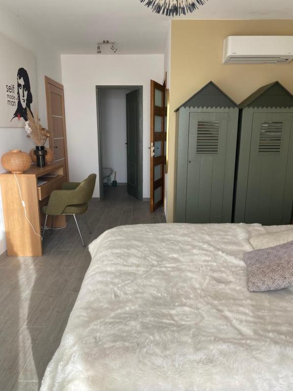 Postel nebo postele na pokoji v ubytování 1,2,3 soleil