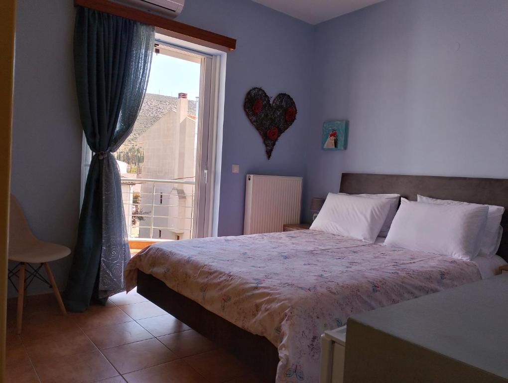 Postel nebo postele na pokoji v ubytování LIGEIA HOME