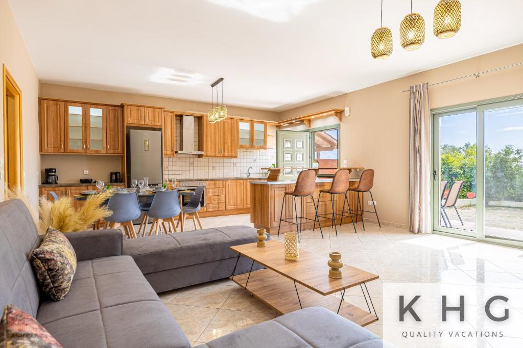 a living room with a couch and a table at Hermes luxury apartment in Vlachata village! in Vlachata